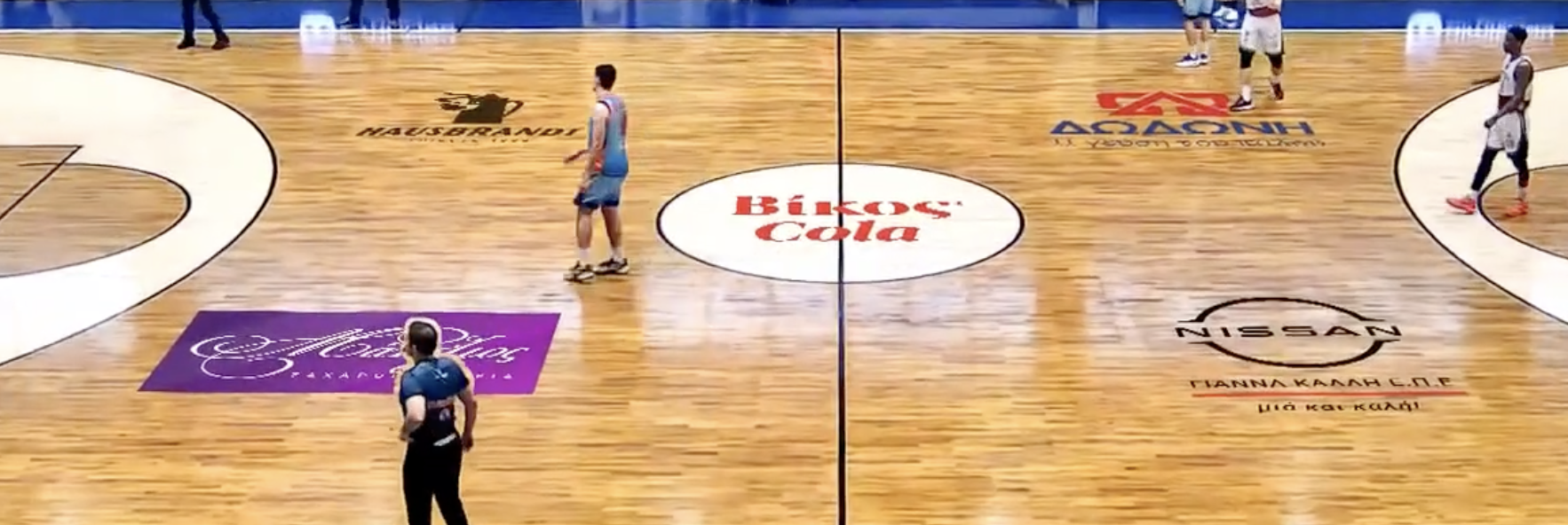 Multiple sponsor logos on court